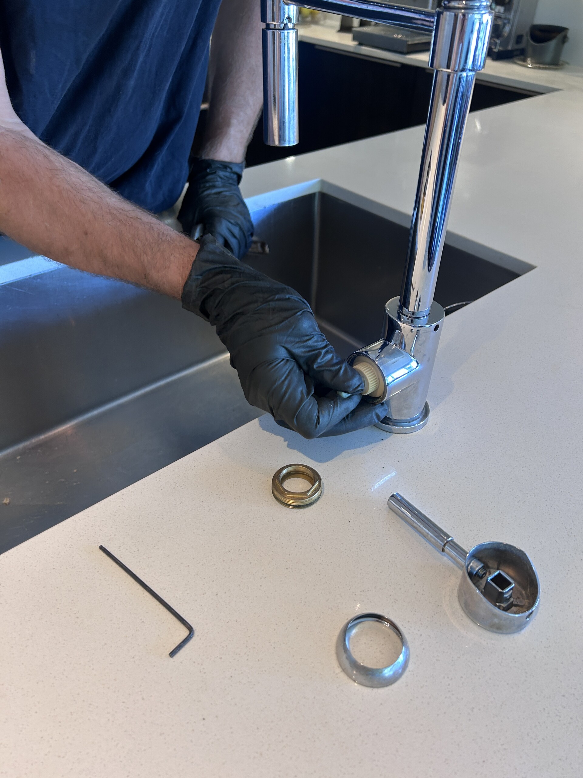 Kitchen faucet cartridge repair Kitchen faucet cartridge replacement - faucet disassembled on the counter